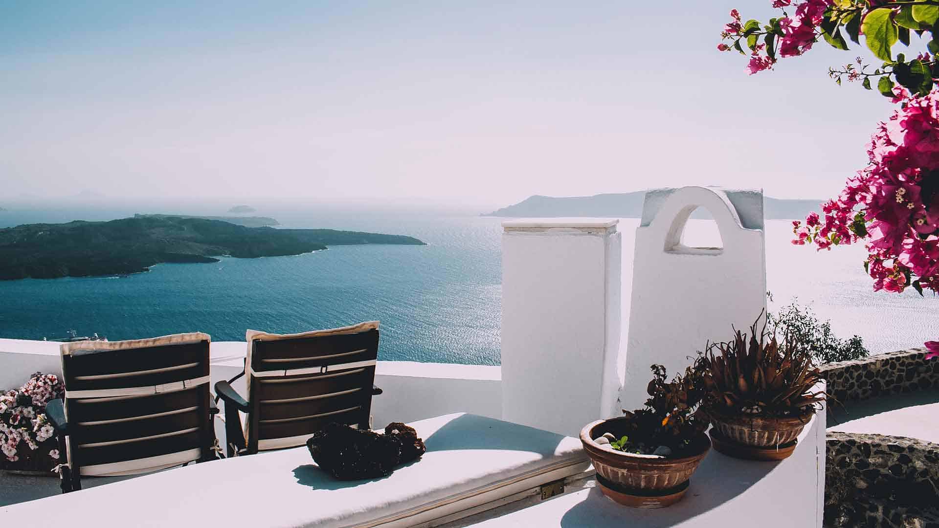 two chairs on a hotel terrace overlooking the sea